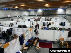 At this camp in eastern Germany, about 140 men share a partitioned gym while they wait, sometimes as long as six months, just to begin the process of establishing legal residence.