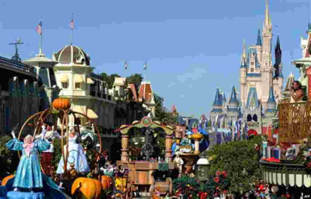 In this publicity image released by Disney, actress and singer Amber Riley from "Glee," right, performs Thursday, Dec. 2, 2010, while taping a segment for the "Disney Parks Christmas Day Parade" at the Magic Kingdom in Lake Buena Vista, Fla. The annual