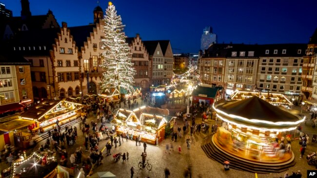 Lights illuminate the Christmas market in Frankfurt, Germany, Nov. 22, 2021.