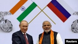 FILE - Russian President Vladimir Putin, left, and India's Prime Minister Narendra Modi attend the inauguration of World Diamond Conference in New Delhi, Dec. 11, 2014.