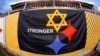 A "Stronger Than Hate" banner is displayed on the sidelines before an NFL Football game, Nov. 8, 2018, at Heinz Field in Pittsburgh. It's a memorial to the 11 people killed in a synagogue on Oct. 27, 2018.