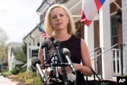 Homeland Security Secretary Kirstjen Nielsen talks outside her home in Alexandria, Va., on April 8, 2019.