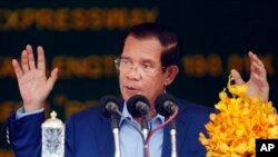 FILE - Cambodia's Prime Minister Hun Sen delivers a speech during a groundbreaking ceremony to build the country's first expressway, in Kampong Speu province, south of Phnom Penh, Cambodia, Friday, March 22, 2019.