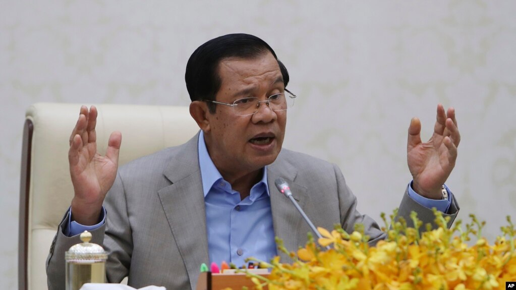 Cambodia's Prime Minister Hun Sen gestures during a speech on the current state of a new virus from China in Phnom Penh, Cambodia, Thursday, Jan. 30, 2020.