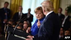 La chancelière allemande Angela Merkel lors d'une conférence de presse conjointe avec le président américain Donald Trump à la Maison Blanche, à Washington DC, le 27 avril 2018.