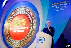 FILE - Intel CEO Paul Otellini makes his speech at the opening ceremony of the assembly and test facility of Intel's chipset products at Saigon High Tech Park, Ho Chi Minh city, Vietnam, on Friday, October 29, 2010.