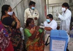 A health worker administers the Covishield vaccine for COVID-19 during a special vaccination drive in Hyderabad, India, Sept. 17, 2021.