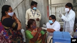 A health worker administers the Covishield vaccine for COVID-19 during a special vaccination drive in Hyderabad, India, Sept. 17, 2021. 