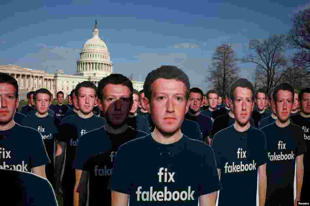 Dozens of cardboard cutouts of Facebook CEO Mark Zuckerberg are seen during an Avaaz.org protest outside the U.S. Capitol in Washington.