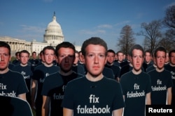 Dozens of cardboard cutouts of Facebook CEO Mark Zuckerberg are seen during an Avaaz.org protest outside the U.S. Capitol in Washington, U.S., April 10, 2018.