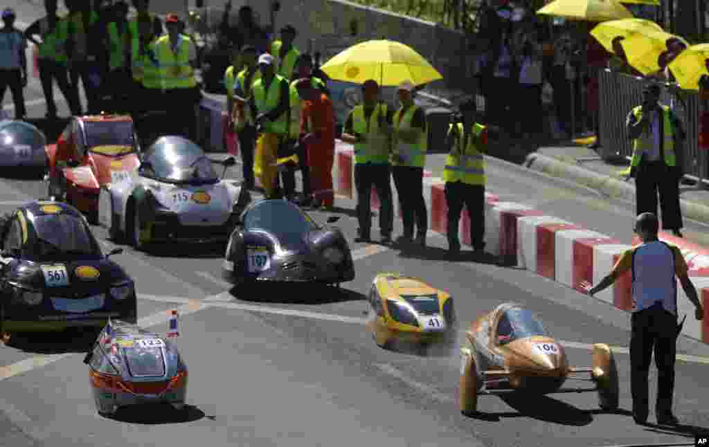 Student-participants from Asian countries prepare to race their hand-made fuel-efficient vehicles during the competition dubbed Shell Eco-Marathon (SEM) Asia in Manila, Philippines. Organizers said the race has attracted 109 students from 15 countries in Asia and the Middle East and is aimed to " showcase their innovations in sustainable mobility."