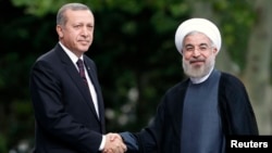 Cumhurbaşkanı Erdoğan geçen yıl Ankara'yı ziyaret eden İran Cumhurbaşkanı Ruhani ile