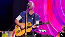 FILE - Chris Martin of Coldplay performs at The Budweiser Made In America Festival in Philadelphia. 