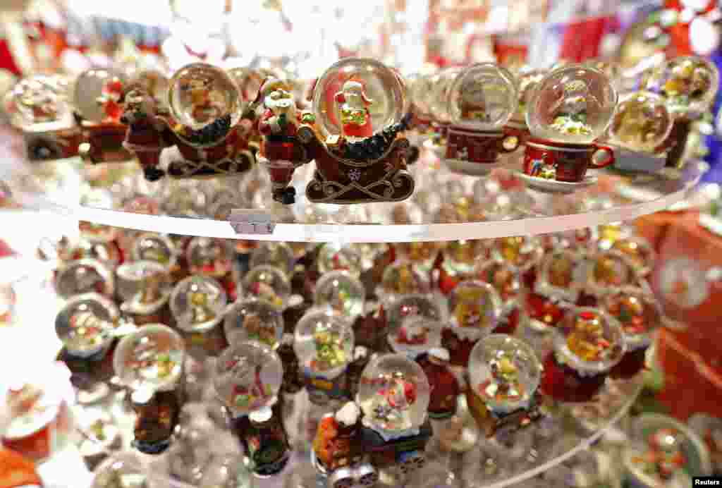 Christmas decorations are seen in a shop during the opening day of the traditional Christmas market in Colmar, eastern France. Security measures have been tightened across the country after last Friday&#39;s attacks in Paris.