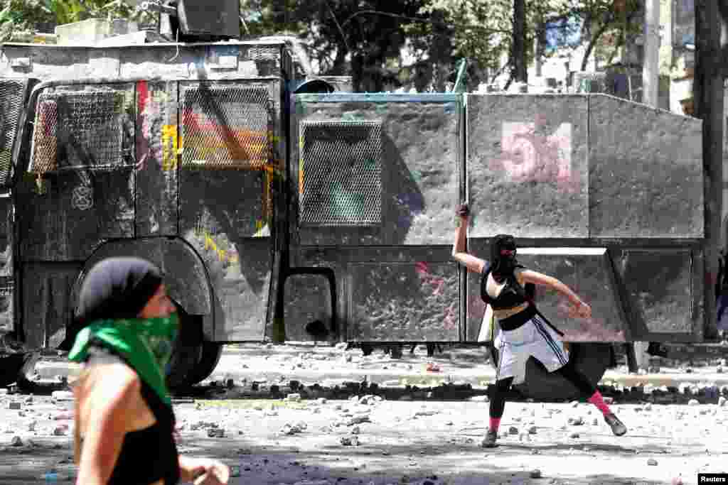 Women clash at a rally during the International Women&#39;s Day in Santiago, Chile, March 8, 2020.