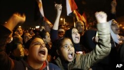 Protesters chant slogans during a demonstration in front of the presidential palace in Cairo, Egypt, Sunday, Dec. 9, 2012.