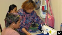 Phyu Phyu Aye teaches sewing and helps her students adapt to a new culture at the Refugee Resource Center.
