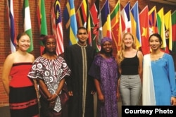 FILE - Berea College international students stand in front of the flags representing the 70 countries where they are from. (Handout photo from Berea)