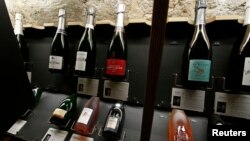 Bottles of Champagne are displayed at Dilettantes wine shop in Paris, France, Dec. 31, 2015. 