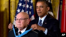 President Barack Obama bestows the Medal of Honor on retired Army Command Sgt. Maj. Bennie G. Adkins in the East Room of the White House in Washington, Monday, Sept. 15, 2014. 