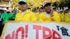 FILE - Farmers attend a rally against Japan participating in rule-making negotiations for the U.S.-led Trans-Pacific Partnership (TPP) in Tokyo.