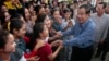 FILE - Cambodia's Prime Minister Hun Sen greets garment workers during a visit to the Phnom Penh Special Economic Zone on the outskirts of Phnom Penh, Cambodia, Aug. 23, 2017. Two Cambodian radio stations said they were being shut down, shrinking the space left for political activity and free expression ahead of next year’s general election.