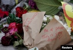 Flowers are seen at a memorial as a tribute to victims of the mosque attacks, near a police line outside Masjid Al Noor in Christchurch, New Zealand, March 16, 2019.