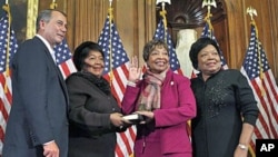 Rep. Eddie Bernice Johnson, D-Texas, second from right, participates in a ceremonial swearing in with House Speaker John Boehner of Ohio, on Capitol Hill in Washington, January 5, 2011 (file photo)
