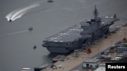 Japan Maritime Self-Defense Force's (JMSDF) latest Izumo-class helicopter carrier DDH-184 Kaga is moored at a naval base in Sasebo, on the southwest island of Kyushu, Japan April 6, 2018.