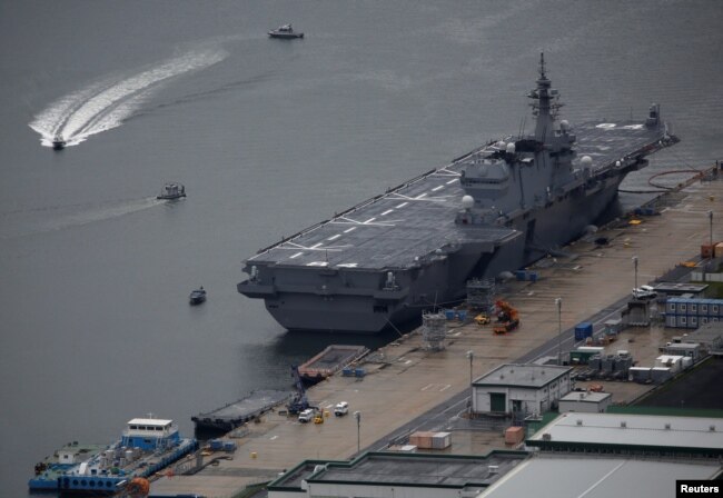 Japan Maritime Self-Defense Force's (JMSDF) latest Izumo-class helicopter carrier DDH-184 Kaga is moored at a naval base in Sasebo, on the southwest island of Kyushu, Japan April 6, 2018.