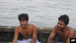 Relatives of a passenger grieve beside the dead body, recovered after an overcrowded ferry capsized near Ghoramara, in Sundarbans Island some 120 Kms (75 miles) south of Kolkata, 30 Oct 2010