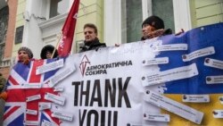 Activists hold a poster to thank the British government for support during a rally at the British Embassy in Kyiv, Ukraine, Jan. 21, 2022. The UK sent 30 elite troops and 2,000 anti-tank weapons to Ukraine amid fears of Russian invasion.