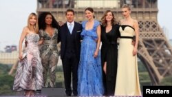 Cast members Tom Cruise, Alix Benezech, Angela Bassett, Michelle Monaghan, Rebecca Ferguson and Vanessa Kirby pose during the world premiere of the film "Mission: Impossible - Fallout" in Paris, July 12, 2018.