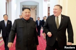 FILE - North Korean leader Kim Jong Un meets with U.S. Secretary of State Mike Pompeo in Pyongyang in this photo released by North Korea's Korean Central News Agency (KCNA), on Oct. 7, 2018.