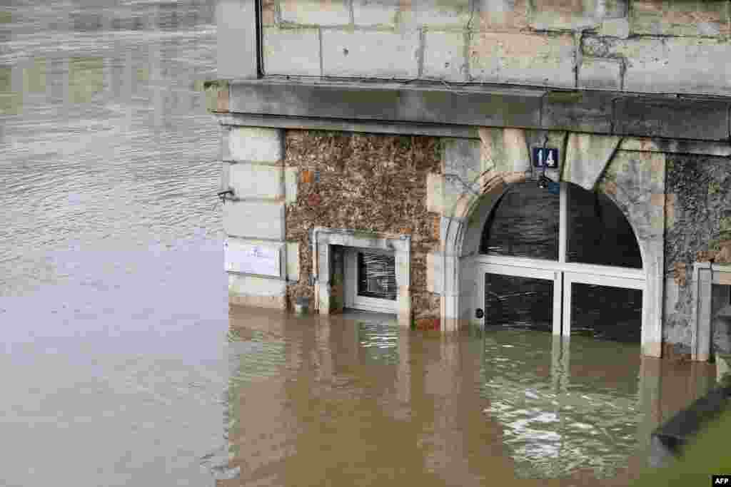 The cafe &#39;Les Nautes&#39; in Paris, France, partly immersed in the the water of the Seine river. The swollen Seine rose even higher, keeping Paris on alert, though forecasters said the flooding should peak by the end of the day.