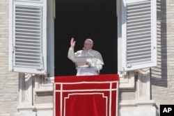 Pope Francis delivers a blessing from his studio window overlooking St. Peter's Square on the occasion of the Angelus noon prayer at the Vatican, Feb. 4, 2018.