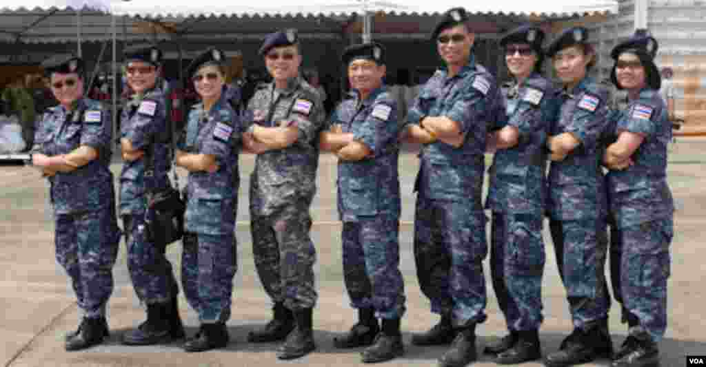 A group of Thai military personnel pose for a photograph after conducting a civilian evacuation drill. (Steve Herman/VOA News)