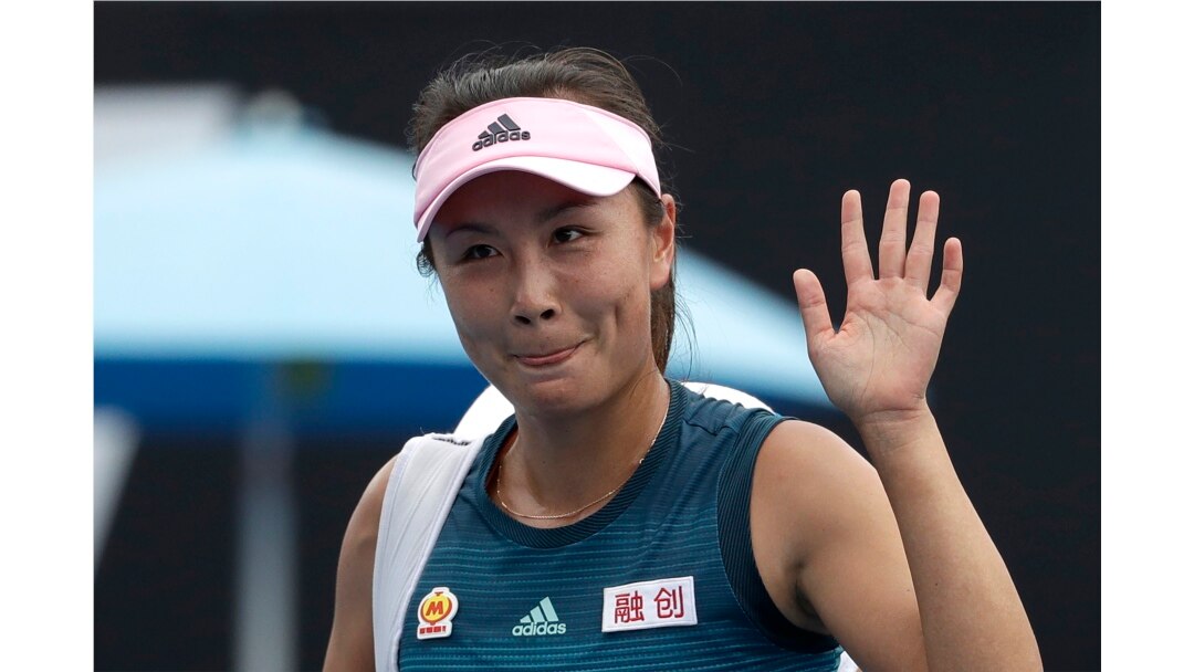 FILE - China's Peng Shuai waves after losing to Canada Eugenie Bouchard in their first round match at the Australian Open tennis championships in Melbourne, Australia on Jan. 15, 2019