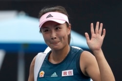 FILE - China's Peng Shuai waves after losing to Canada Eugenie Bouchard in their first round match at the Australian Open tennis championships in Melbourne, Australia on Jan. 15, 2019