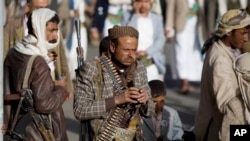 FILE - Houthi Shiite militants attend rally to show support for their leader Abdel-Malik al-Houthi, Sanaa, Yemen, Feb. 20, 2015.