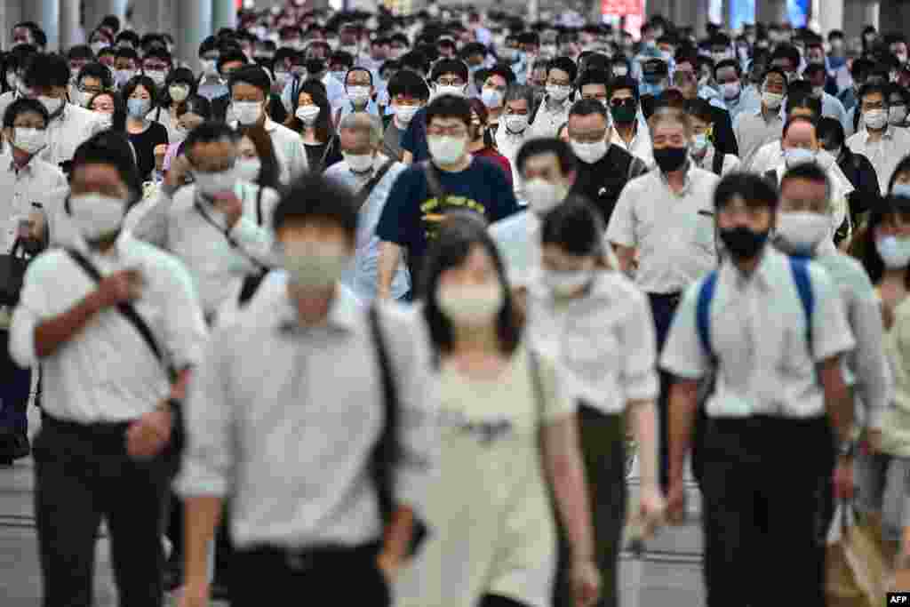 People commute early morning in Tokyo, Japan.