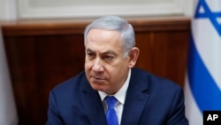 FILE - Israeli Prime Minister Benjamin Netanyahu chairs the weekly cabinet meeting in Jerusalem, March 3, 2019.