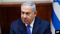 FILE - Israeli Prime Minister Benjamin Netanyahu chairs the weekly cabinet meeting in Jerusalem, March 3, 2019.