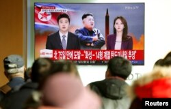 People watch a TV broadcasting a news report on North Korea firing what appeared to be an intercontinental ballistic missile (ICBM) that landed close to Japan, in Seoul, South Korea, Nov. 29, 2017.