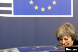 Britain's Prime Minister Theresa May leaves an EU summit in Brussels, Dec. 15, 2016.