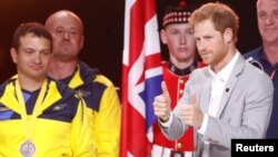 Britain's Prince Harry walks on the stage during the closing ceremony for the Invictus Games in Toronto, Ontario, Sept. 30, 2017.