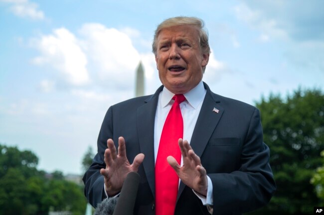 FILE - President Donald Trump speaks to reporters on the South Lawn before leaving the White House in Washington, May 20, 2019.