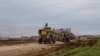 Konvoi kendaraan militer AS di Desa Khirbet Amo dekat Qamishli, Suriah, 12 Februari 2020. (Foto: SANA via Reuters)