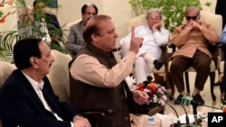 This photo released by Pakistan's Muslim League shows ousted Pakistani Prime Minister Nawaz Sharif addressing party members in Islamabad, Pakistan, July 29, 2017.