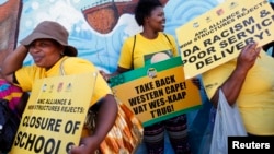 Supporters of President Jacob Zuma's ruling African National Congress await the start of a march to the headquarters of the opposition Democratic Alliance in Cape Town, South Africa, Feb. 5, 2014.